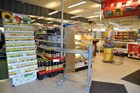 Butiksvogn med fjederbelastet hylde