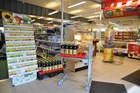 Butiksvogn med fjederbelastet hylde